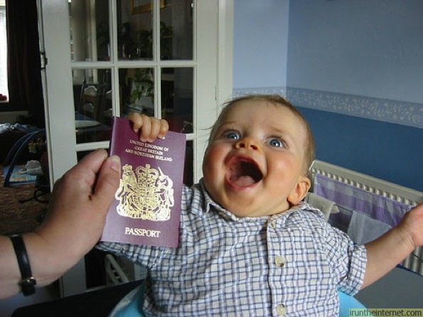 kid-really-happy-with-passport-125829467